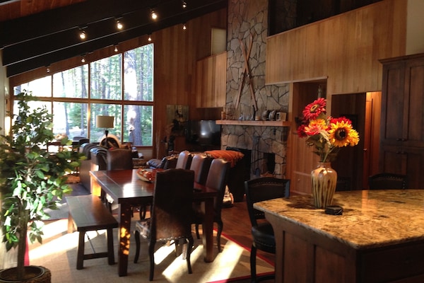 View from kitchen looking out at the golf course and 15th green. Dinning for 12