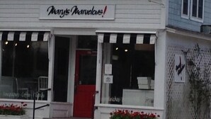 A storefront with a sign reading "Mary's Marvelous!" and a red door. - Perfect Family home, AC, Heated Pool, 3BR 2Bath (East Hampton)