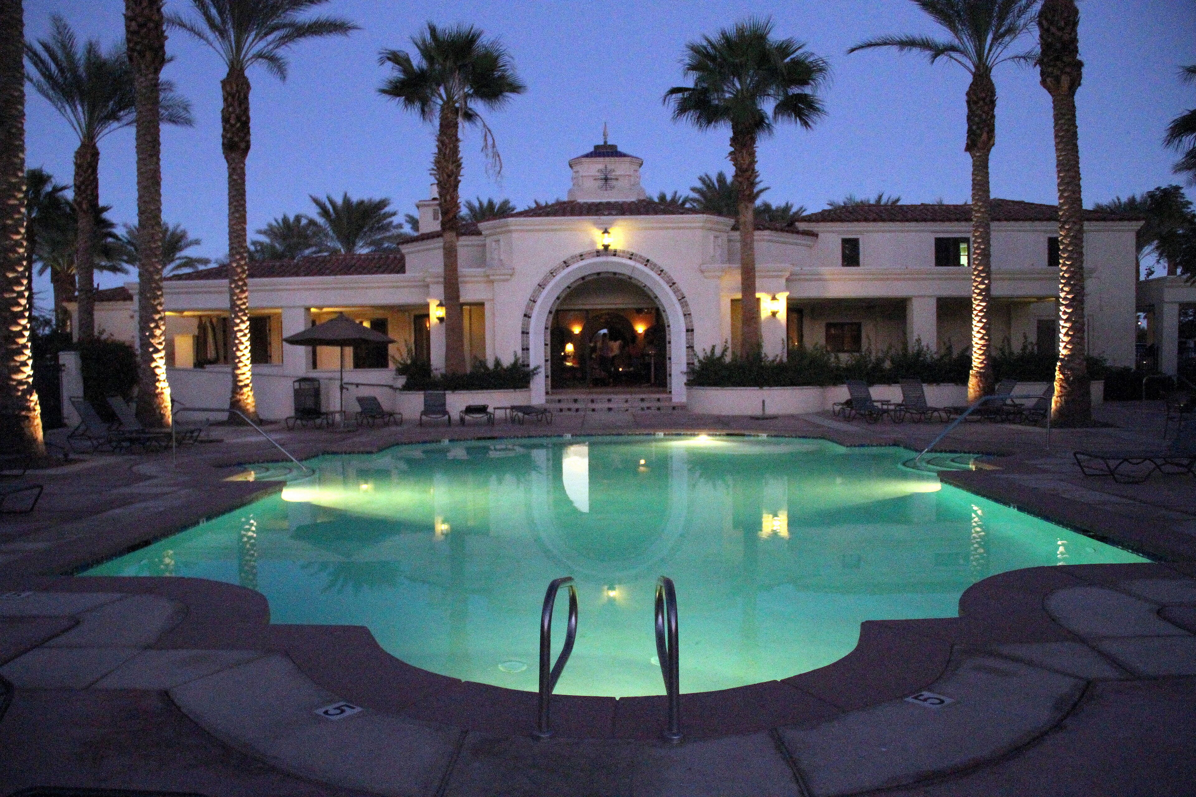 Heated pool and club house at night