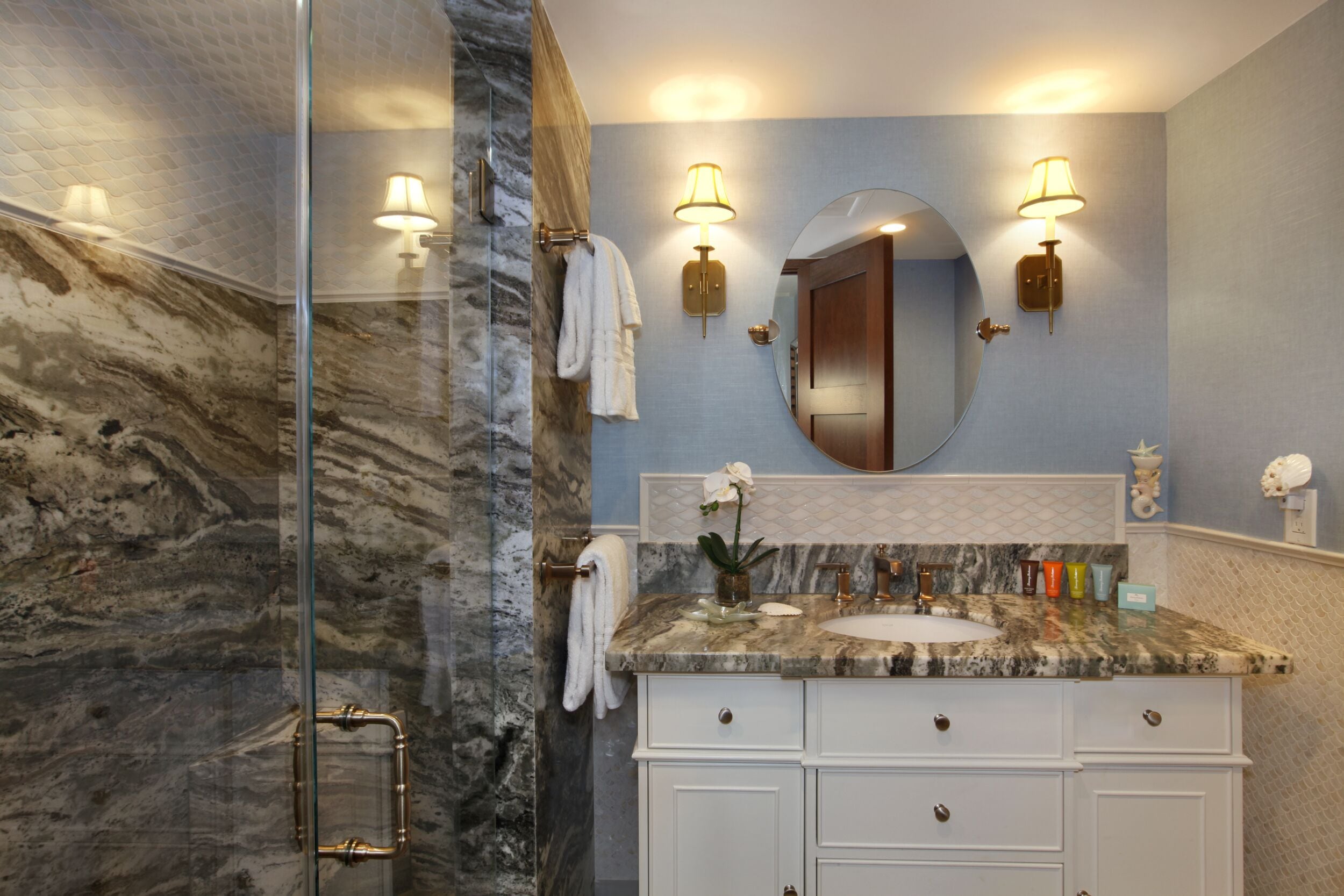 bathtub, hair dryer, towels, shampoo