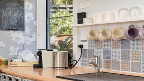 Fridge, microwave, stovetop, coffee/tea maker