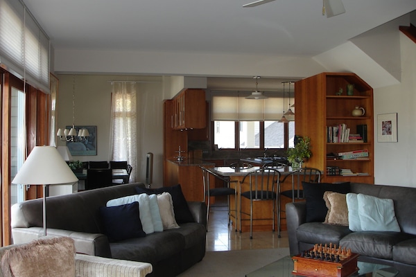 Living Room looking to kitchen and dining room