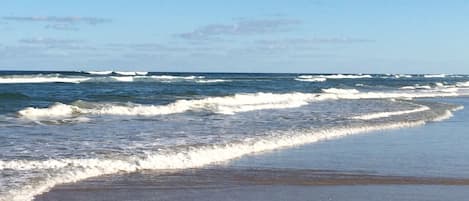 On the beach, sun-loungers, beach towels