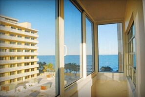 Enjoy ocean views from the large window in this stylish room.