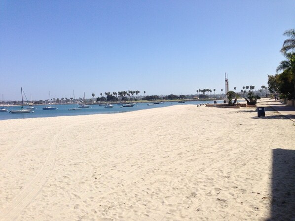 Enjoy a serene beach experience with access to boats and scenic views of the surrounding area.