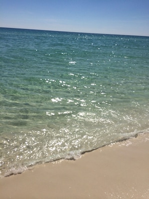 A beach with clear water and a sandy shore. - Perfect Gulf Front Beach House *Beach Club Amenities*The Best of Both Worlds! (Gulf Shores)