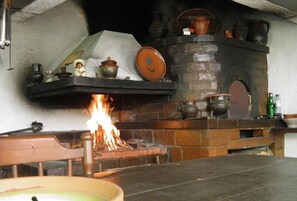 Cozy up by the crackling fireplace, surrounded by warm, inviting decor.