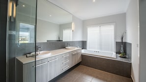 Bathtub, jetted bath, hair dryer, towels