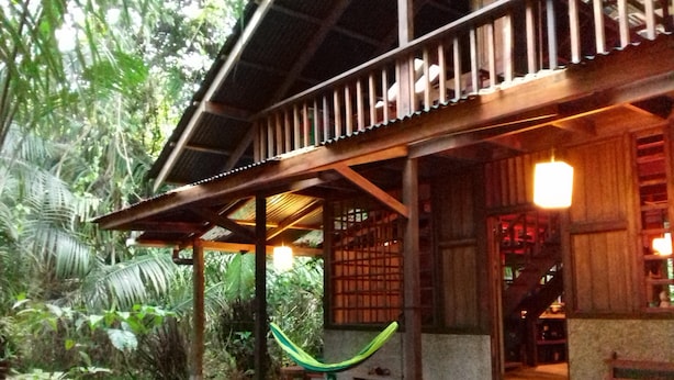 A wooden structure with a porch, a hammock, and a bench. - Beachfront-rainforest tropical paradise retreat, Drake Bay, Osa Peninsula (Bahia Drake)