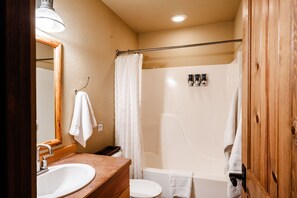 A bathroom with a sink, toilet, and shower. - Ski-In/Out Mountain Cabin Home! Private Hot Tub, Stunning Views, 7min Drive to R (Big Sky)
