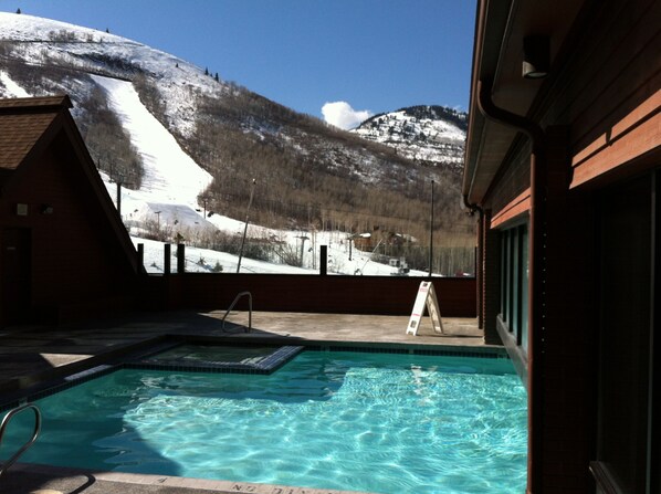 Relax by the pool with a breathtaking view of the surrounding mountains.