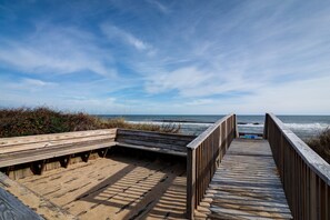 A wooden boardwalk leading to the beach with a bench and a sign. - 4209- Moby Duck - Duck Retreat | Walk to Beach & Village (Duck)