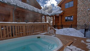 A wooden cabin with a swimming pool surrounded by snow. - Rustic Mountain Charm at The Canyons (Park City)