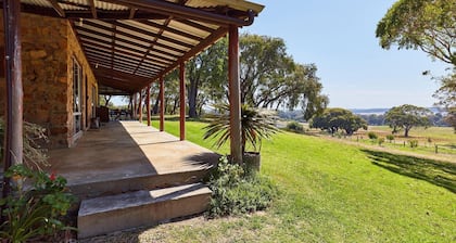 The Homestead driveway is located on the right, just passed the winery.
