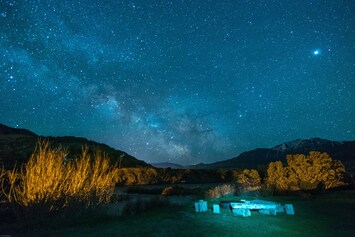 The cabin's backyard.  Fire pit under the stars.