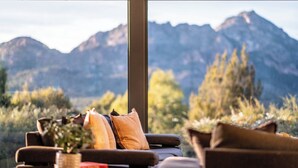 A cozy seating area with a view of mountains. - The Loft - Freycinet Holiday houses (Coles Bay)