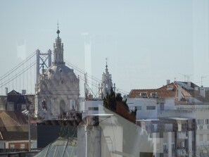 A building with a large dome and a tower, surrounded by other buildings.