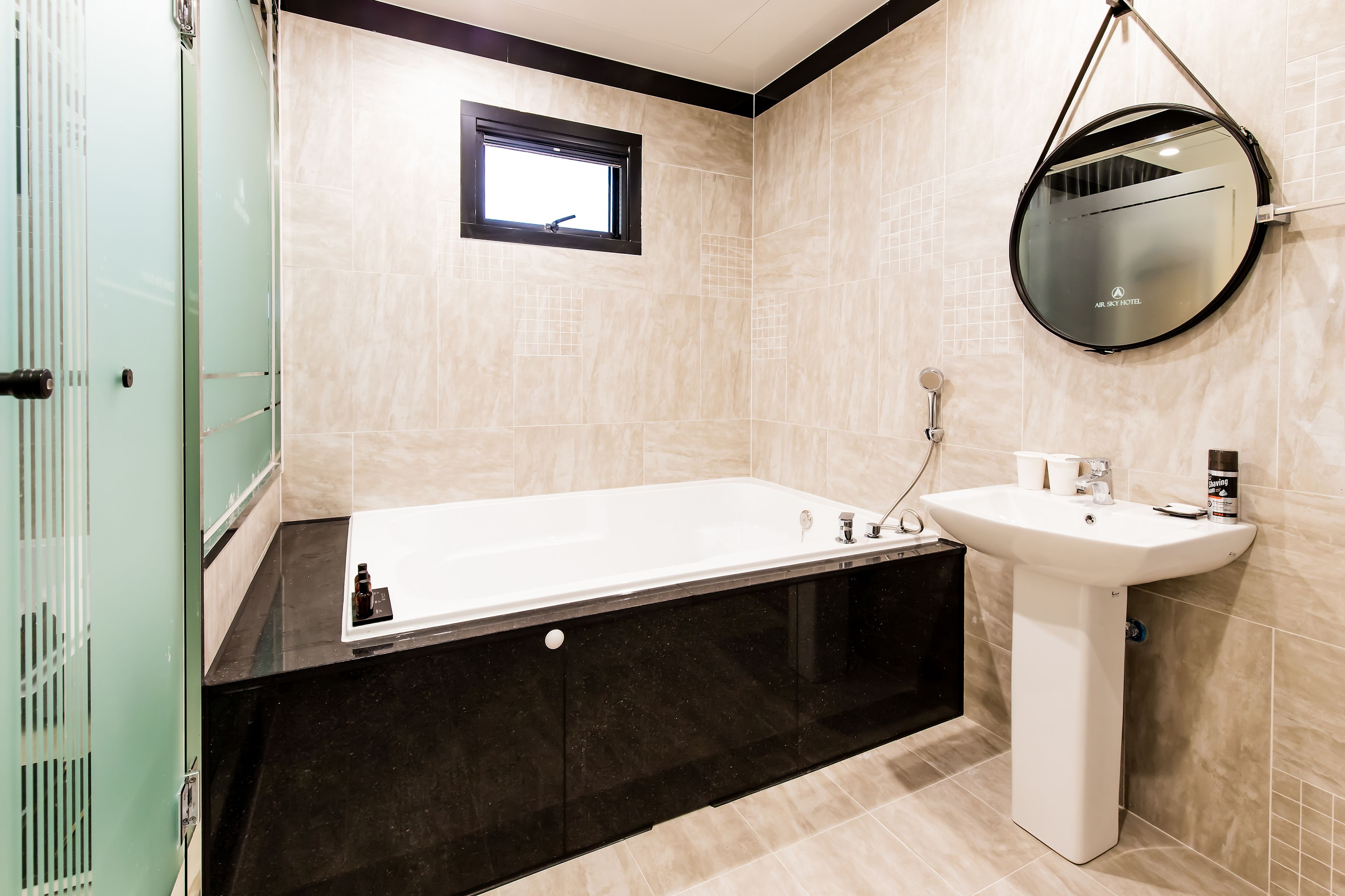 business room | bathroom | combined shower/bathtub, deep-soaking bathtub, designer toiletries