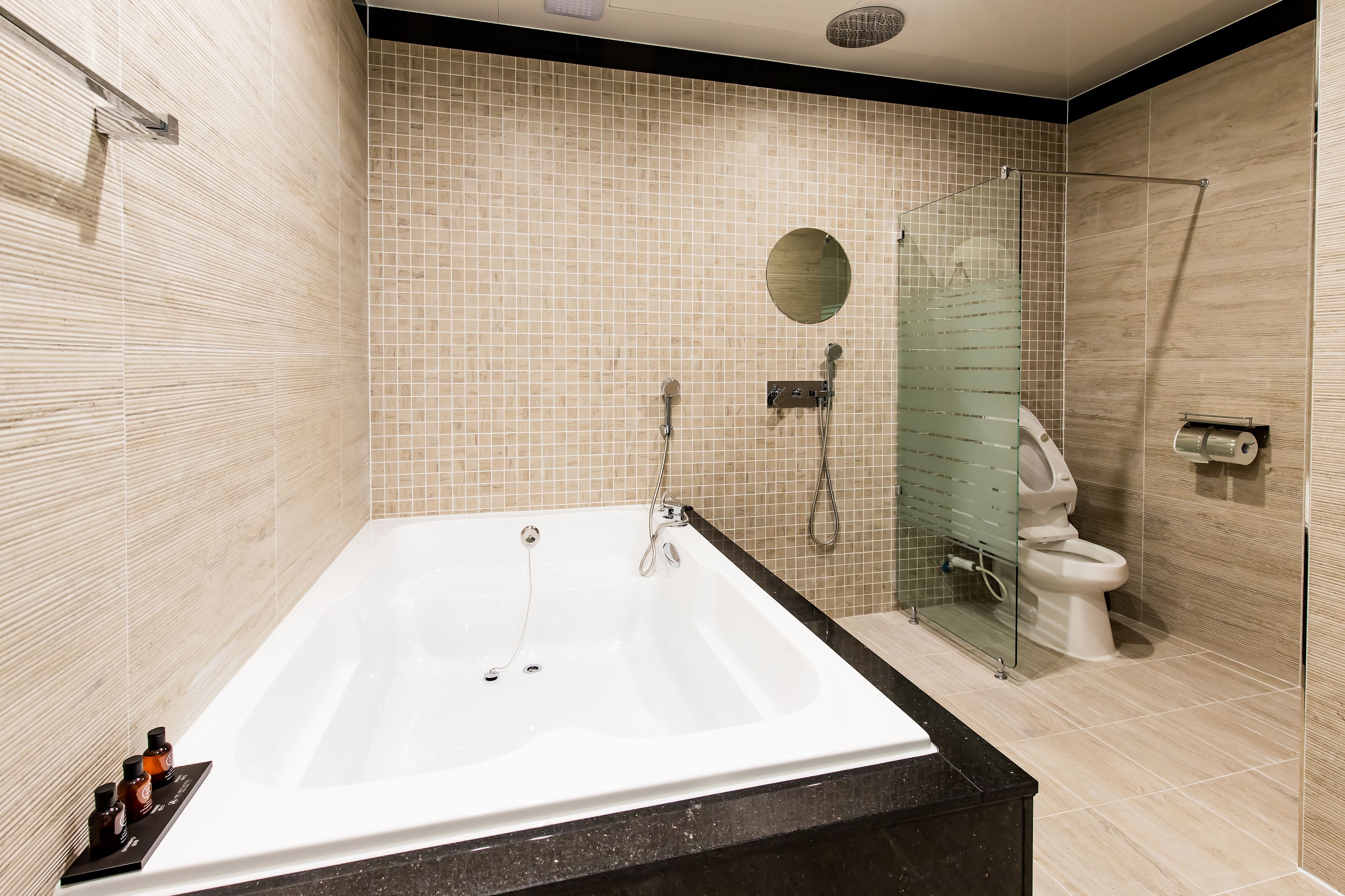 combined shower/bathtub, deep-soaking bathtub, designer toiletries