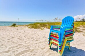On the beach, sun-loungers, beach towels