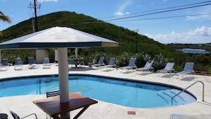 A swimming pool with lounge chairs and a covered seating area. - The Captain and the Mermaid - Adventures in Paradise are waiting! (St Thomas)