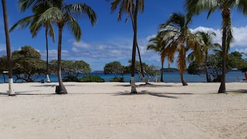 On the beach, sun-loungers, beach towels