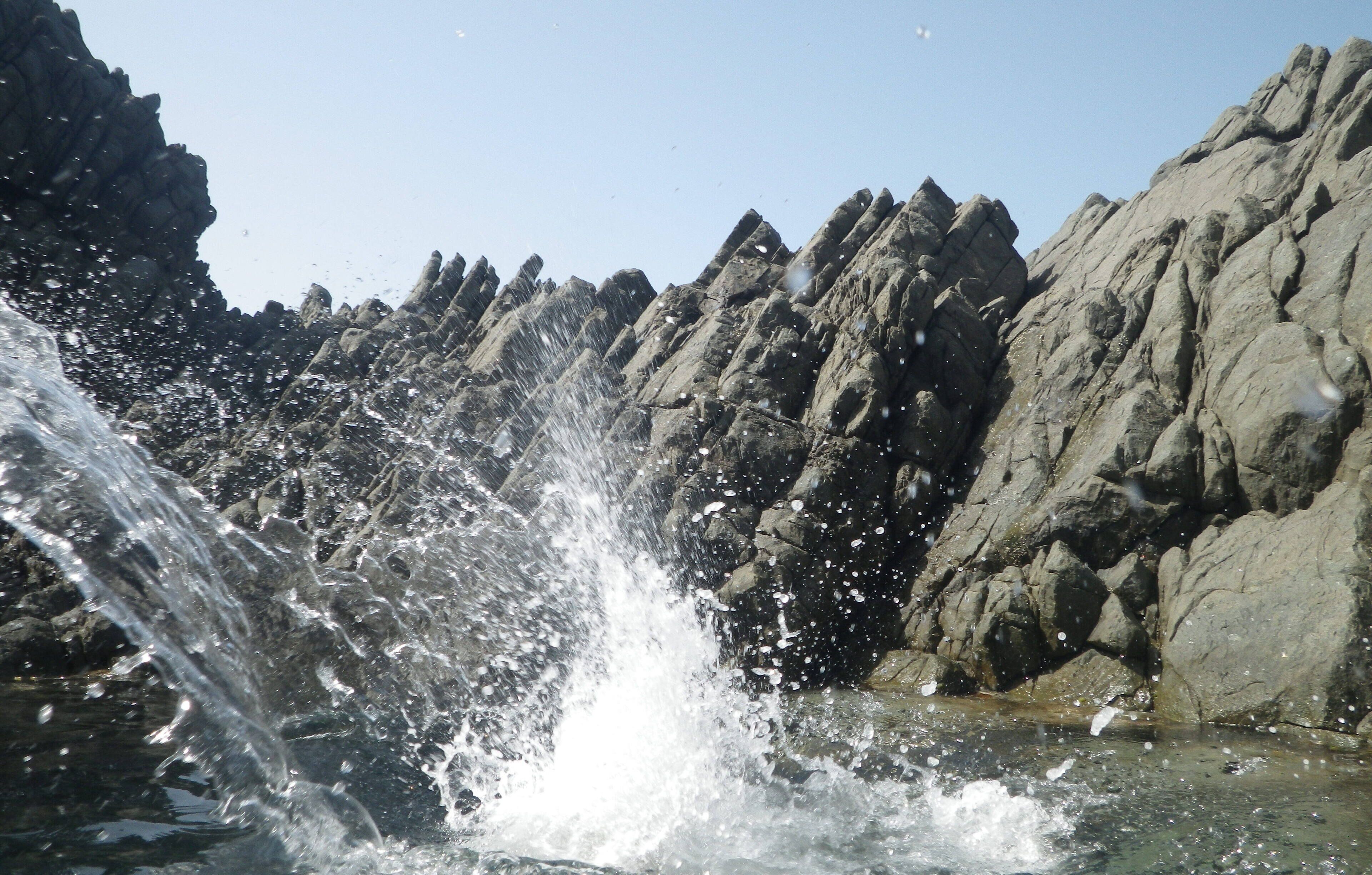 A waterfall cascading over rocky terrain.