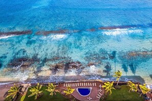 On the beach, sun loungers, beach towels