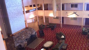 A multi-level hotel lobby with a red carpet, multiple seating areas, and a fireplace. - Ski-in/Ski-out, Penthouse Unit w/ Awesome Views, Walk to Village! (Snowshoe)