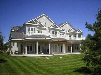 Lake Charlevoix view. Building is 4 units. 2 up and 2 down. Ours is the top left