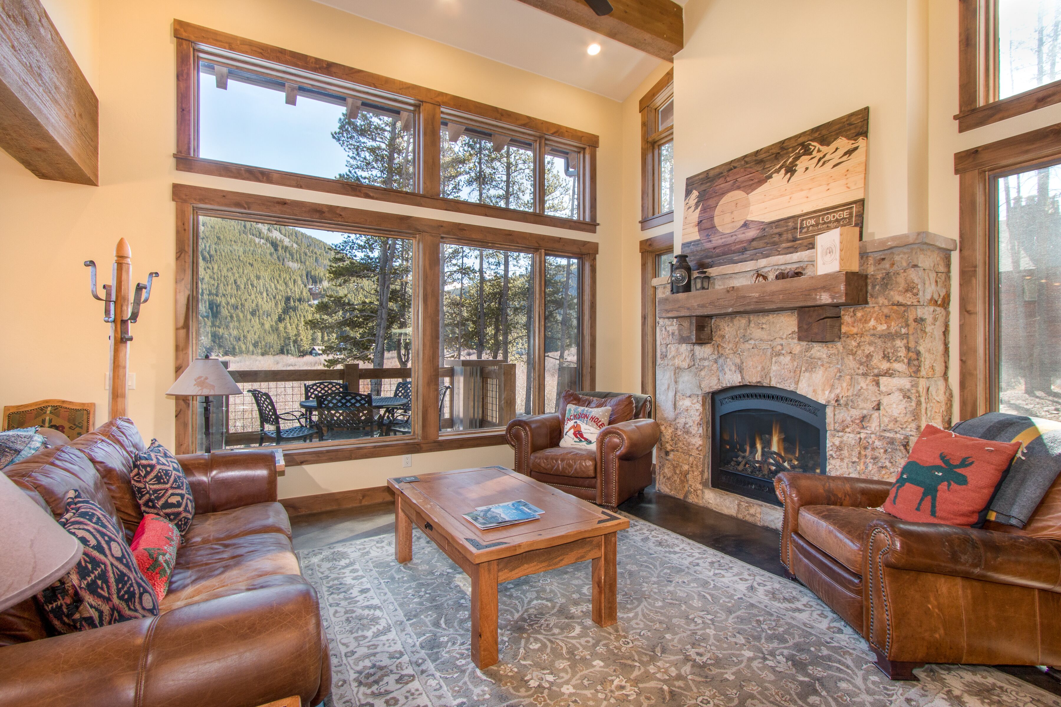 Unobstructed mountain views and a cozy stone fireplace. 