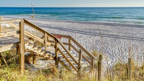 A wooden staircase leading to a beach with a sign indicating beach rules. - From sunrise surf to sunset sips at Beach Life /Gulf Front, Driect Access to Beach from Balcony (Santa Rosa Beach)