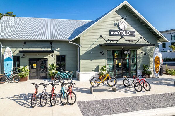 A building with a sign reading "Board YoLo Bike".