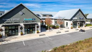 A commercial building with storefronts for Turbo Coffee and Pepermint Cafe. - From sunrise surf to sunset sips at Beach Life /Gulf Front, Driect Access to Beach from Balcony (Santa Rosa Beach)