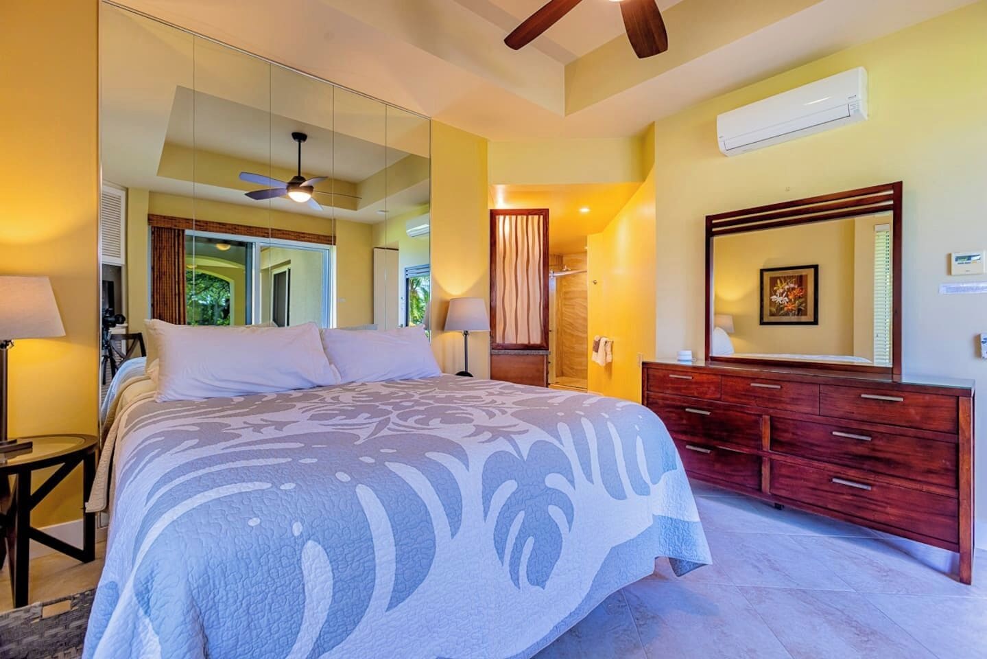 the main bedroom features a Cal-king bed, A/C and an attached private bathroom