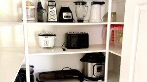A kitchen pantry with various appliances including a blender, toaster, and slow cooker. - Spacious & Spotless Family Retreat -Single-Story Comfort – Close to Everything! (Mesa)