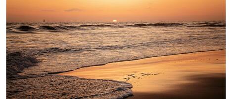 On the beach, sun loungers, beach towels