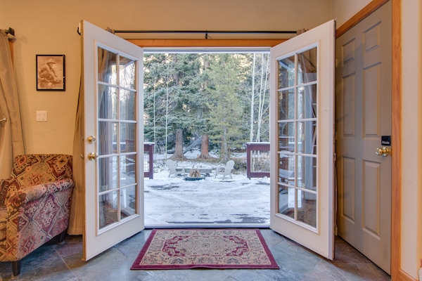 French doors invite you to outdoor decks, fire pit, and creekside seating