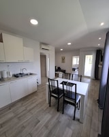 Apartamento, 1 quarto | Cozinha privada | Geladeira, micro-ondas, cooktop, máquina de café expresso