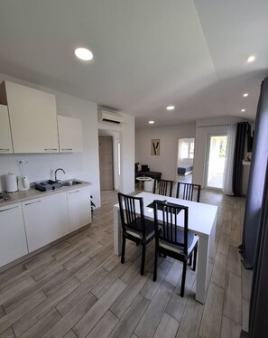 Apartment, 1 Bedroom | Private kitchen | Fridge, microwave, stovetop, electric kettle