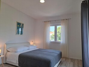 Apartment, 1 Bedroom | 1 bedroom, desk, laptop workspace, iron/ironing board