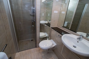 Bathtub, hair dryer, towels