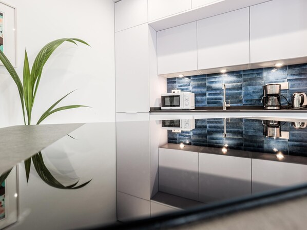 Fridge, microwave, coffee/tea maker, toaster