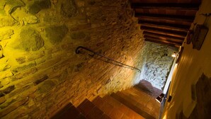 A stone staircase with a metal handrail, leading to a lower level. - Apartment/ flat - Chianni (Chianni)