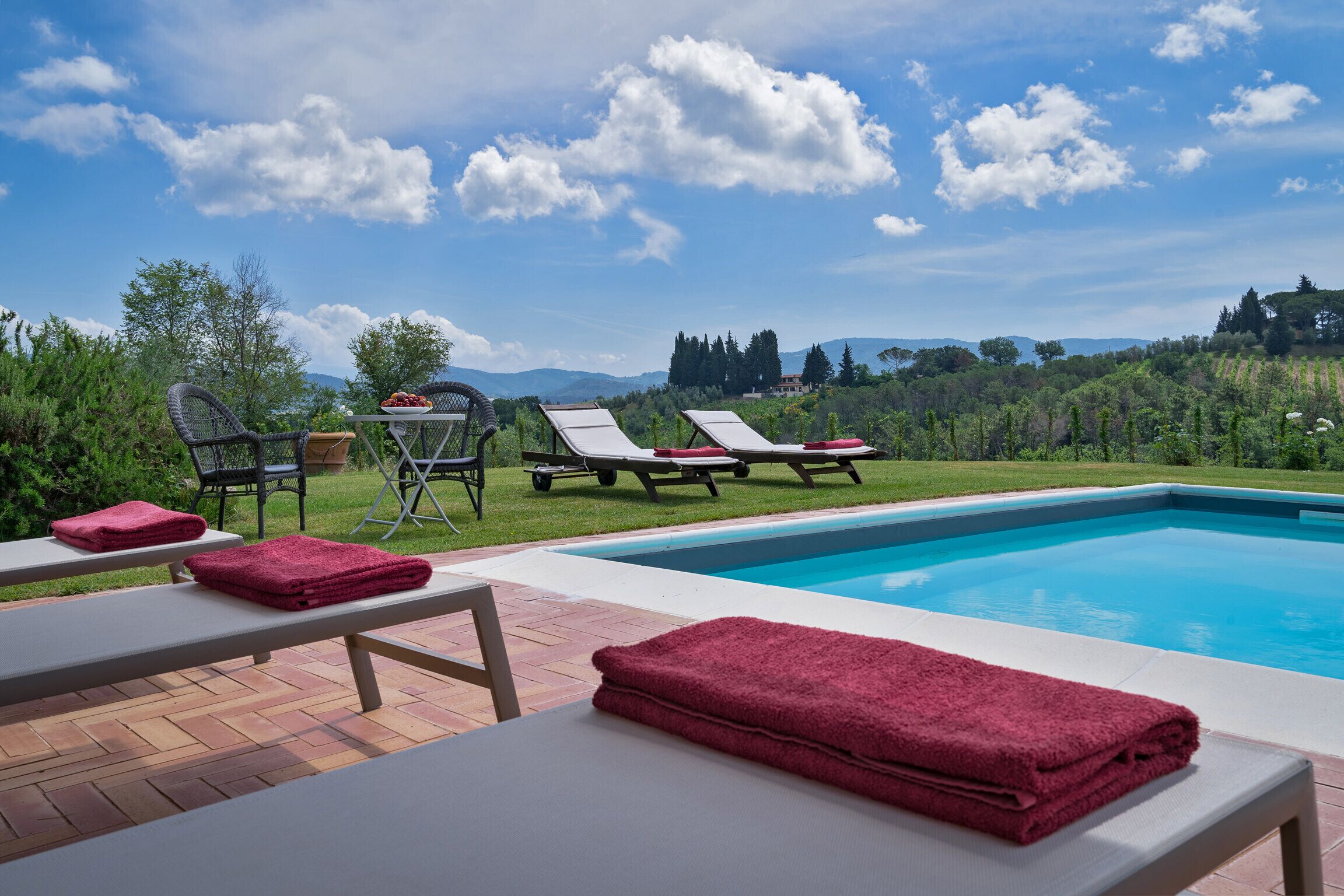 Outdoor pool, a heated pool, sun loungers