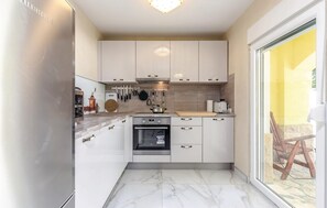 Fridge, stovetop, dishwasher, coffee/tea maker