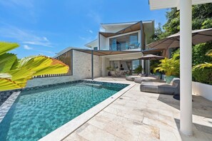 Outdoor pool, an infinity pool, pool loungers