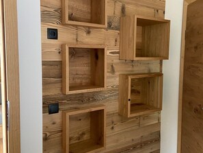 A wall with multiple wooden storage boxes of varying sizes. - 2 room apartment no. 2 - Alt Filzmoos, Das Anja (Filzmoos)