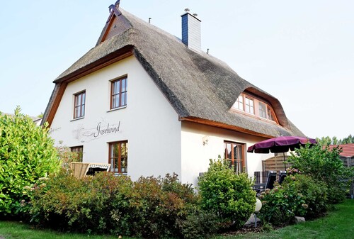 Holiday home with fireplace and sauna