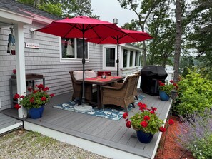 Outdoor dining - Enjoy the lake, dock, beach, large grounds, or renovated home.  New ductless AC. (East Falmouth)